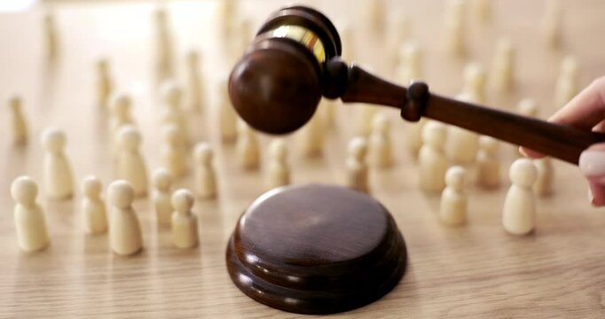 An arrangement of game pieces plus a gavel, symbolizing leadership in strategy games and competitions