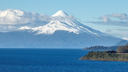 Osorno Vulcan At Puerto Montt In Los Lagos Chile. Volcano Landscape. Sky Clouds Background. Los Lagos Chile. Road Trip Mountain. Osorno Vulcan At Puerto Montt In Los Lagos Chile.