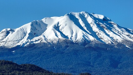 Calbuco Volcano At Puerto Varas In Los Lagos Chile. Volcano Landscape. Sky Clouds Background. Los Lagos Chile. Snowcapped Mountain. Calbuco Volcano At Puerto Varas In Los Lagos Chile.
