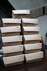 Close up photo of neatly arranged brown food boxes