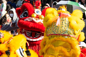 Chinese lion dance show on street in the Chinese New Year festival.Chinese lion costume used during...