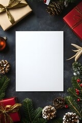 Blank paper surrounded by Christmas gifts, ornaments, and pine cones on dark background.