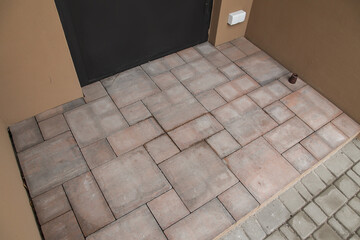 Paving Slabs. Empty Place for Door Mat Entryway Outdoor Mat Brown floor tiles. Top View