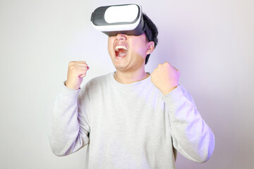 Excited young Asian wearing VR headset happy smile on web banner grey background.