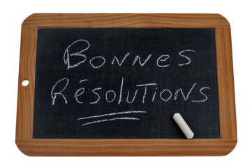 Obraz premium Ardoise d'école sur laquelle est écrit avec une craie bonnes résolutions en français