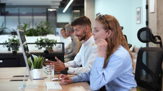 Man and colleagues in a call center office for customer service help and support