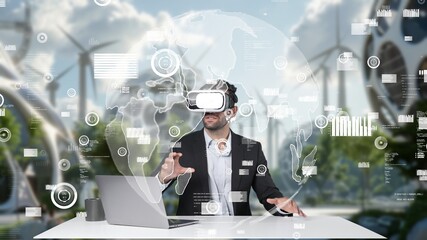 Project manager turn VR glasses on and present idea while looking at global communication hologram floating. Business man sitting at table with laptop while using virtual reality headset. Apparatus.