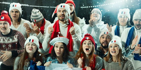 French sports fans, men and women waving their flags and celebrating, creating vibrant and...