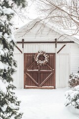 Winter barn with rustic wreath surrounded by snow-covered landscape during a calm season