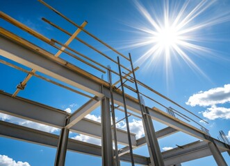 Construction beams under a bright sky