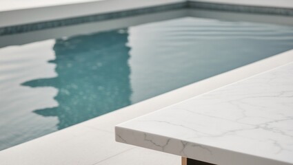 Obraz premium white marble top with blurred empty Swimming pool background can be used for mocking up or display product to make advertising.