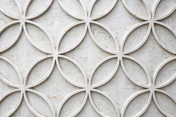 Intricate Circular Floral Design Etched in Light Gray Stone Wall