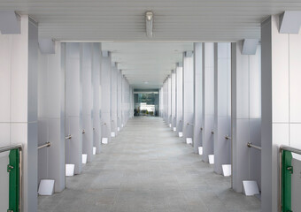 Long corridor to entrance modern building.