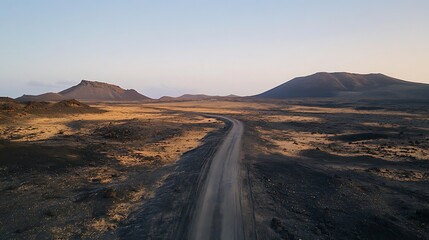 Fototapeta premium Volcanic Landscape Road Winding Through Mountains