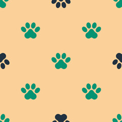 Green and black Paw print icon isolated seamless pattern on beige background. Dog or cat paw print. Animal track. Vector © Vadim