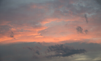 sunset scenery, soft grey and pink clouds, horizontal background