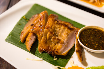 Thai food grilled pork with Thai or charcoal-boiled pork neck with the sauce is spicy sour taste, a popular appetizer in Thailand.