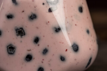 Fototapeta premium blueberry yogurt with slices and whole berries