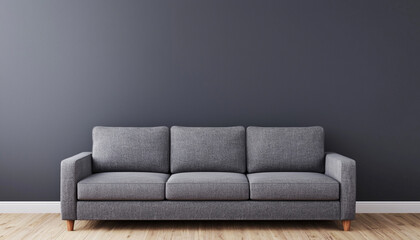 Modern gray sofa against a dark wall in a minimalist living room, showcasing simplicity and contemporary style.