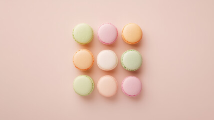 Assorted macarons arranged in perfect grid, showcasing pastel colors and delightful textures. These sweet treats are perfect for any celebration or dessert table