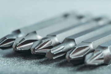 Fototapeta premium Set of bits for tightening screws in closeup. Tool for the master.