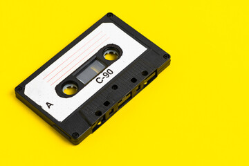 Obraz premium Old vintage audio cassette on yellow background.