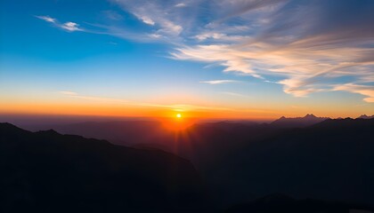 Obraz premium Serene Sunrise Over Majestic Mountain Range Under Vibrant Sky