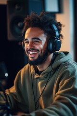 Obraz premium Man with Headphones at Computer