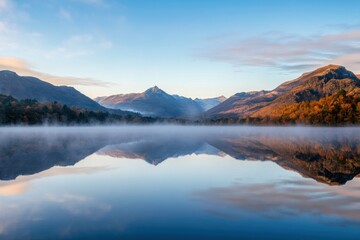 Serene Autumn Lake Reflecting Majestic Mountains