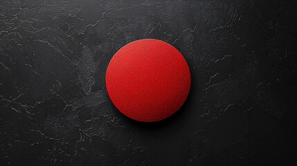 Vibrant red circle on a minimalist black background creates a striking visual contrast