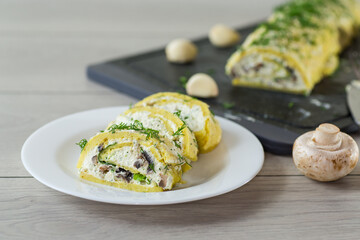 baked potato roll with cottage cheese filling with garlic and mushrooms, on a light wooden table