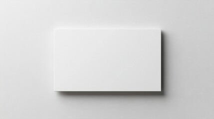 Fototapeta premium A minimalist blank card on a neutral background, emphasizing simplicity and potential for creativity.