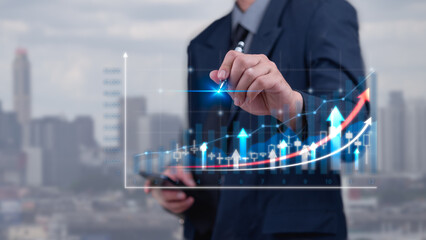 Businessman hand touching graph and arrow chart. Financial business and economic planning marketing using strategy of management stability to growth