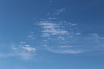 Obraz premium blue sky background with blurred light white clouds