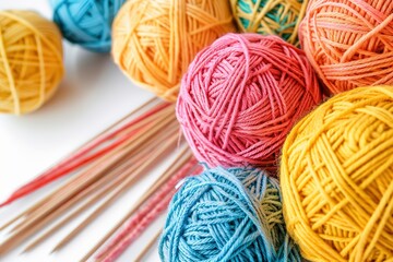 A bunch of colorful yarn balls and knitting needles