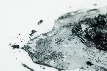 Obraz premium A close-up shot of various black substances on a white surface