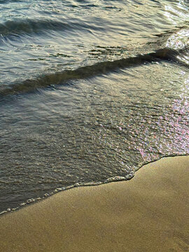 Sea waves on sandy beach 