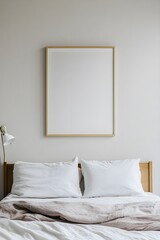 A white poster frame above a bed, captured from a slightly overhead angle, emphasizing the symmetry of the room.
