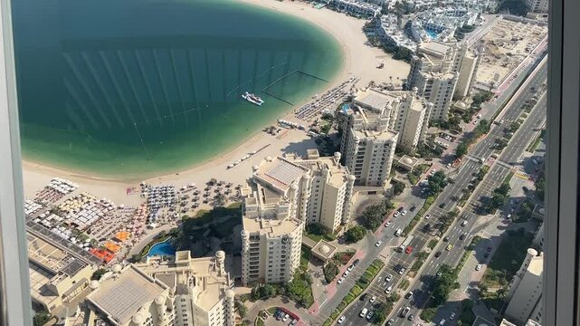 Aerial view of houses, the Palm Jumeirah beach and the Persian Gulf of Dubai