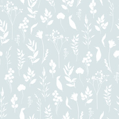 Floral seamless pattern. White silhouettes of wild grasses, twigs, leaves and flowers on a blue background. Monochrome two-colour pattern for textile