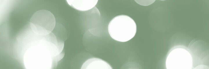 Blurred lights, green background, banner texture. Abstract bokeh with soft light header. Wide screen wallpaper. Panoramic web banner with copy space for design