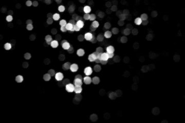 White gray blurred bokeh lights on black background. Glitter sparkle stars for celebrate. Overlay for your design © MariiaDemchenko