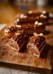 Chocolate eclairs topped with peanuts