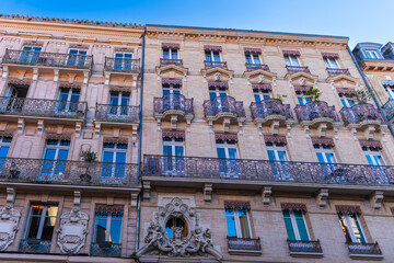 Facades of houses in Toulouse downtown, in Occitanie, France