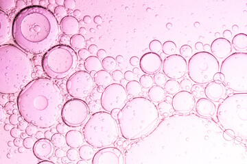 Close up macro pink drink bubble texture,Water drops on a pink background close-up,bubbles chemical...