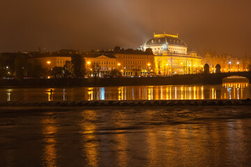 Panoramic view of the city of Prague at night in a magical foggy atmosphere, Czech Republic.
