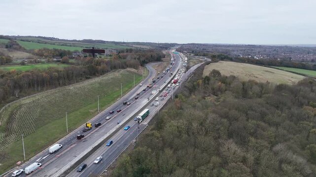 Traffic congestion caused by road work on a highway in the UK countryside