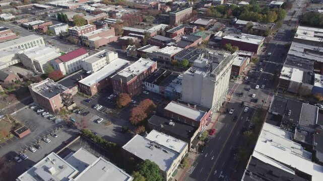 Aerial push over Salisbuy, North Carolina, approaching moving train