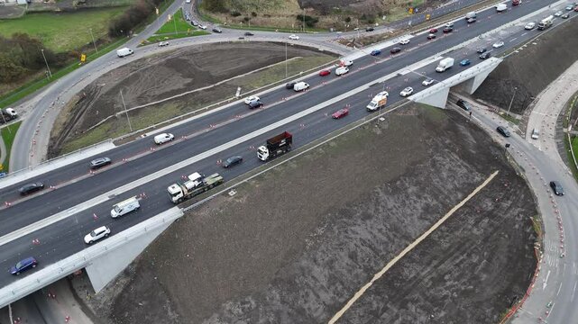 Traffic congestion and road work disrupt flow near UK roundabout