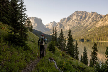 A young man hikes on a backcountry trip in the Wind River Range in Wyoming.